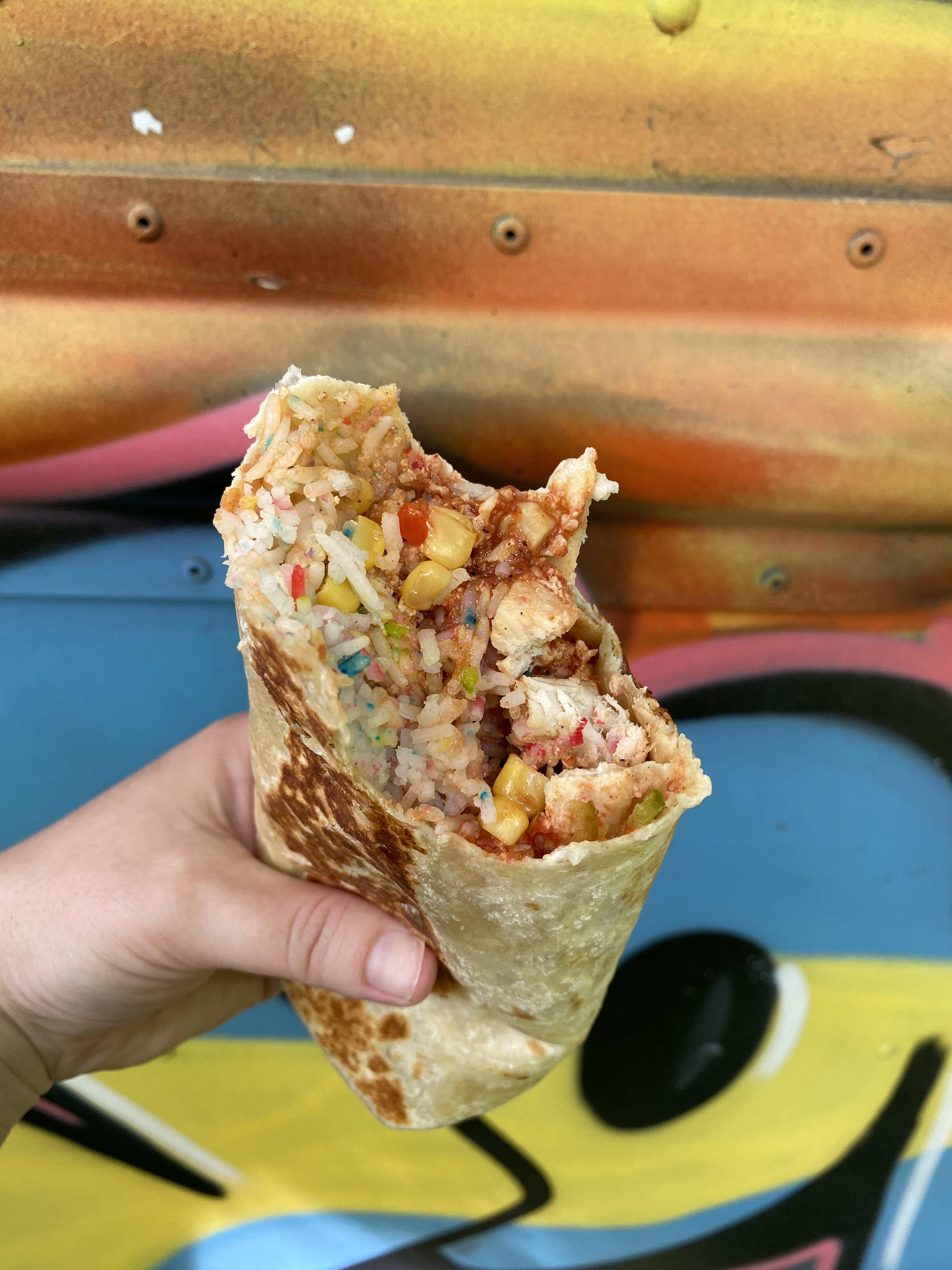 Open half burrito with rainbow rice