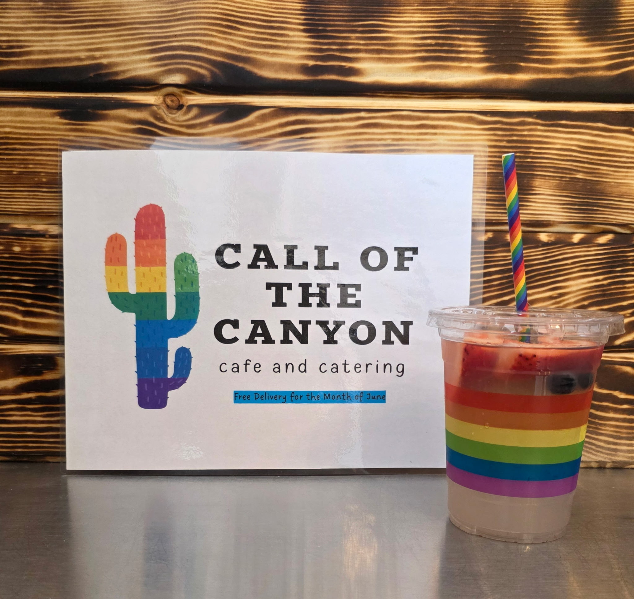 Lemonade with a rainbow themed cup and straw